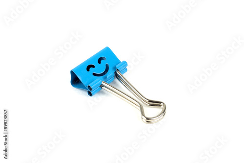 Blue happy face paperclip on white background. 