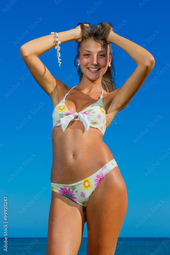 Pretty girl in bikini at the beach Stock Photo | Adobe Stock