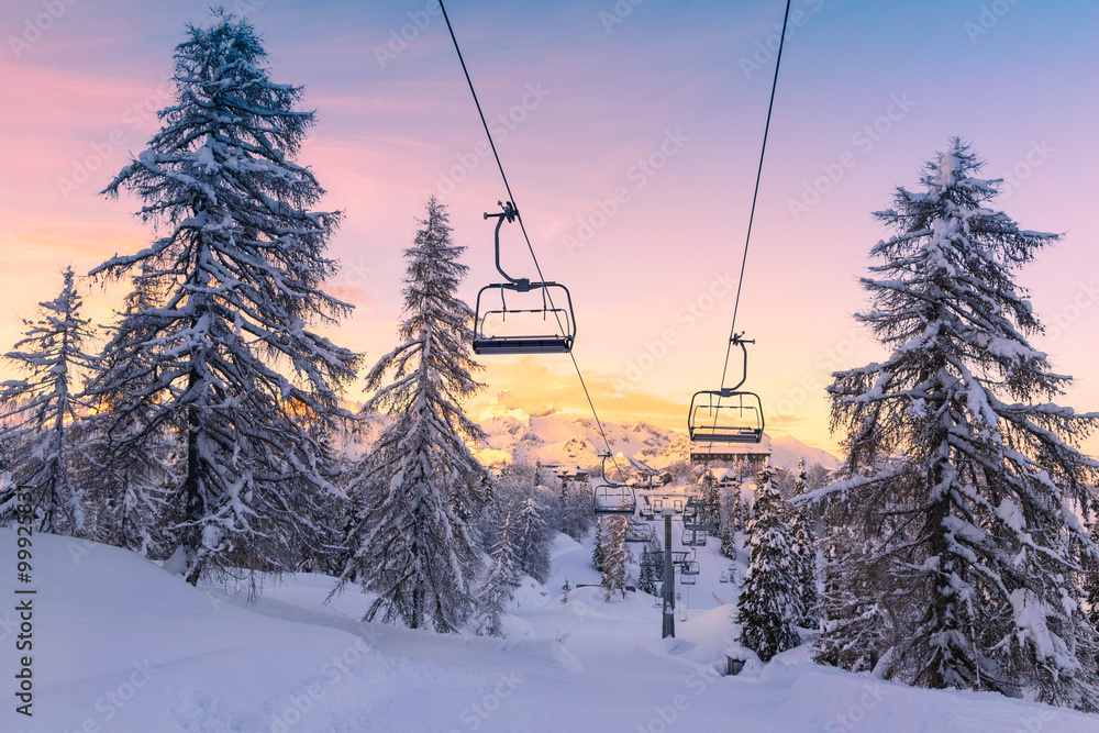 Fototapeta premium Winter mountains panorama with ski slopes and ski lifts