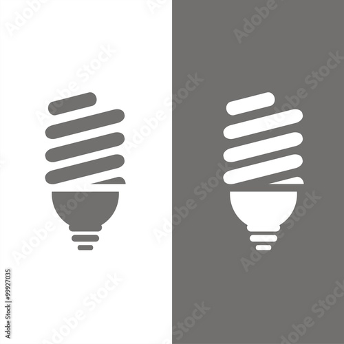 Icono de una bombilla sobre fondos blanco y negro. Ilustración vectorial