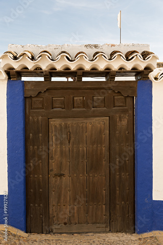 Puerta de madera con tejadillo. photo