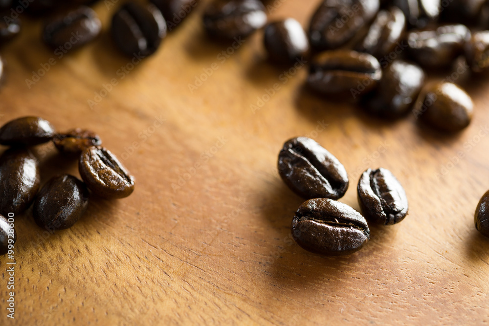 Close up of Coffee bean on wooden table Close up of Coffee bean on wooden table