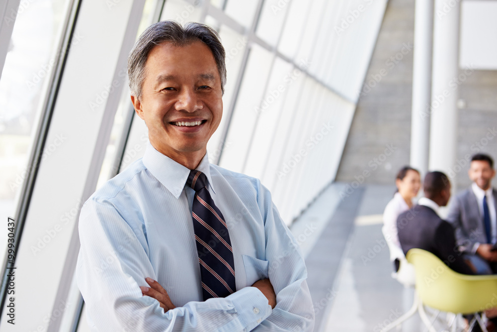 Fototapeta premium Portrait Of Asian Businessman In Modern Office