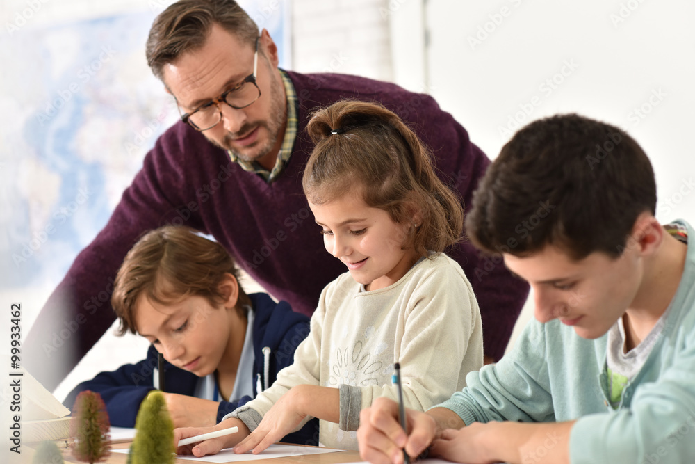 Pupils taking notes during science class Pupils taking notes during science class