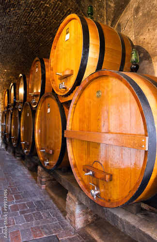 Old traditional dark wine cellar with big wooden barrels © dennisvdwater