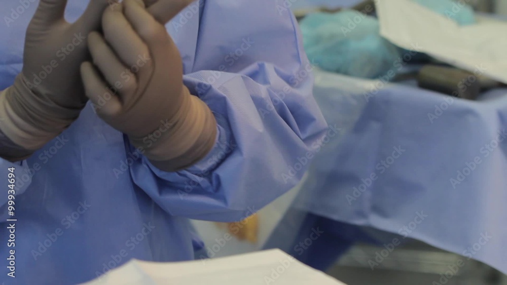 Wearing surgical gloves
Nurse wears surgical gloves and helps to wear gloves to the surgeon (CU) Wearing surgical gloves
Nurse wears surgical gloves and helps to wear gloves to the surgeon (CU)