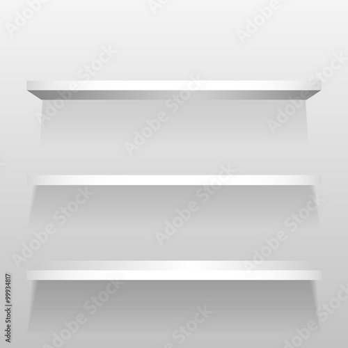 White empty shelves on the white store wall. For book or product presentation.