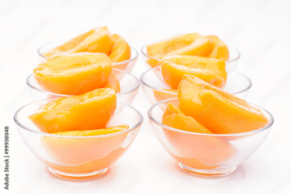 Cut peaches in syrup isolated on white Cut peaches in syrup isolated on white