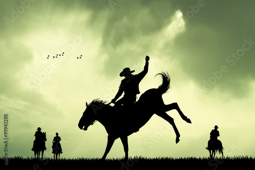 rodeo cowboy silhouette at sunset