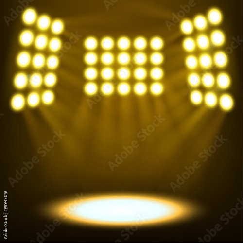 Bright stadium spotlights on dark yellow background