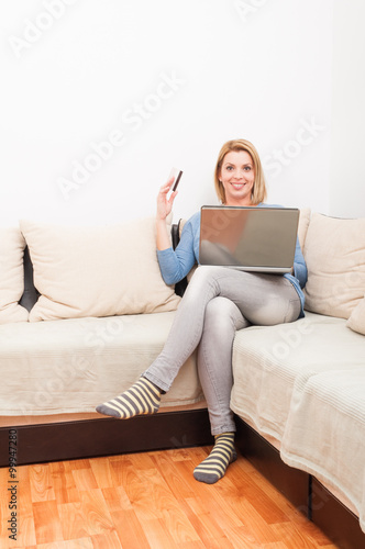 Single mother shopping online using credit card