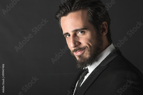 Business bearded man on black backgroung 
