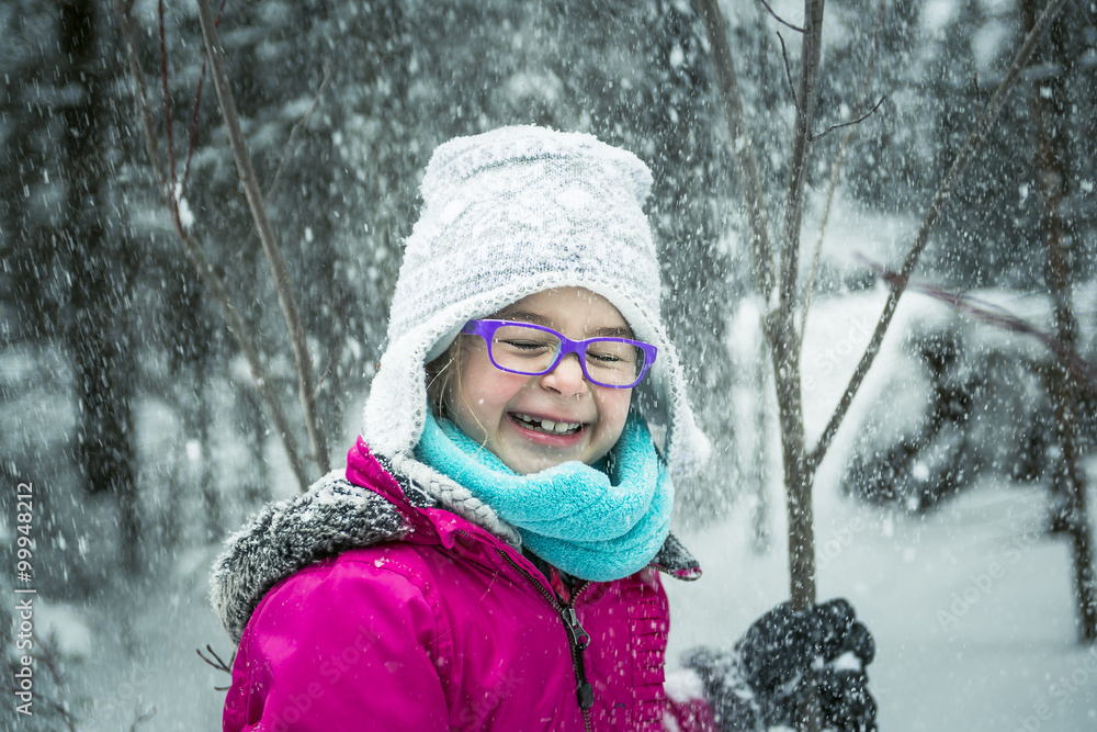Little Girl Playing with Snow Outdoors in Winter Little Girl Playing with Snow Outdoors in Winter
