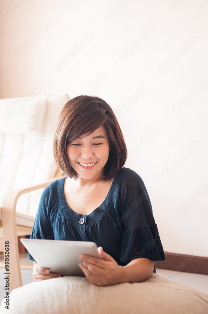 Young asian woman holding blank digital tablet. Young asian woman holding blank digital tablet.
