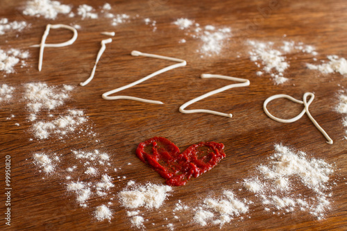 Wallpaper Mural  Painted heart of ketchup, written text "pizza" of mayonnaise and flour on wood table. Torontodigital.ca