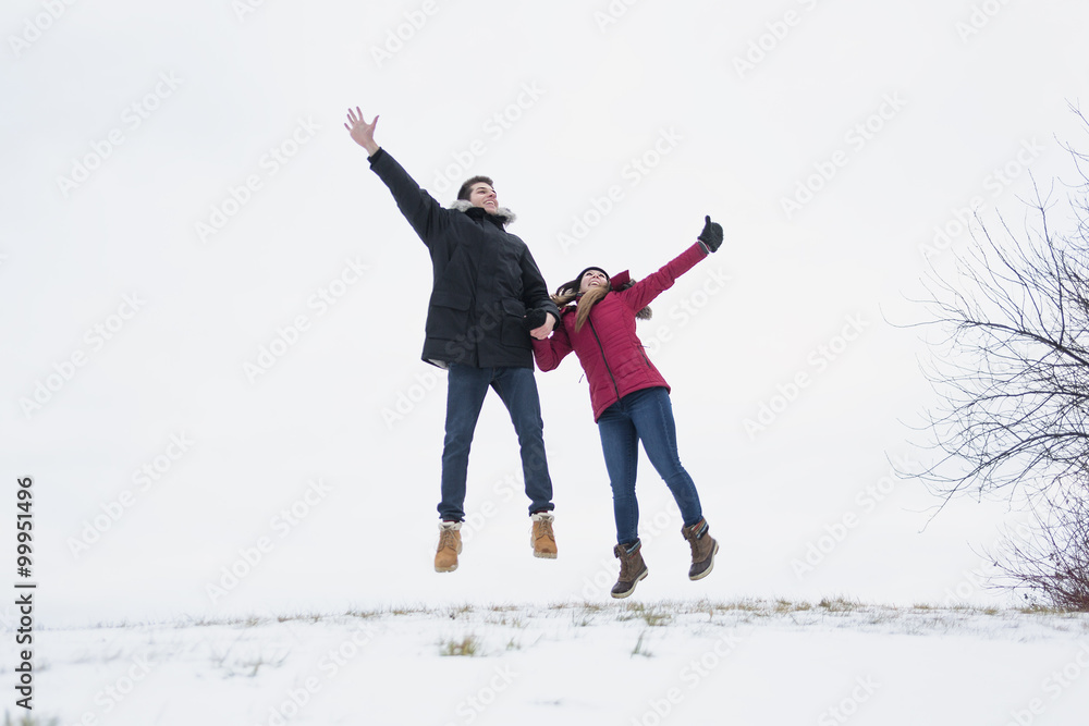 Two teenagers havinf fun on the snow field Two teenagers havinf fun on the snow field