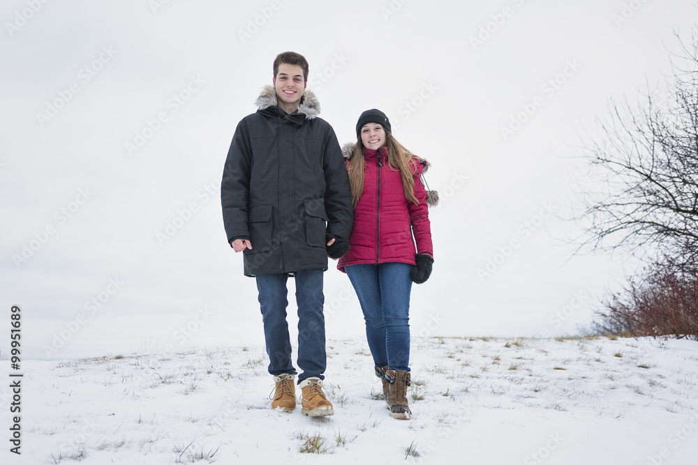 Two teenagers havinf fun on the snow field Two teenagers havinf fun on the snow field