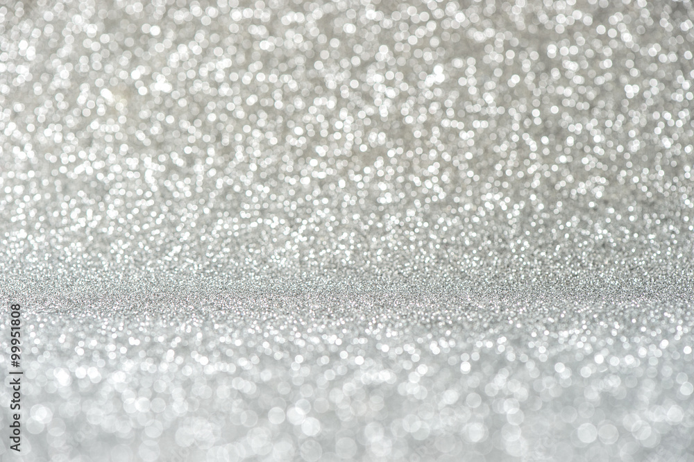 Glitter and lights. Shiny silver background