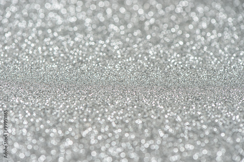 Glitter and glow. Shiny silver background. Abstract texture