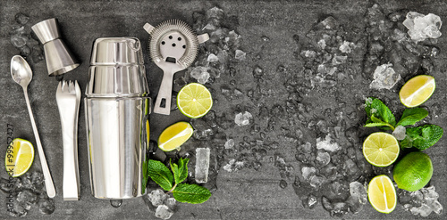 Accessories and ingredients for cocktail lime, mint, ice photo
