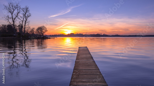 Fototapeta Naklejka Na Ścianę i Meble -  Panorama of purple Sunset over Serene Lake