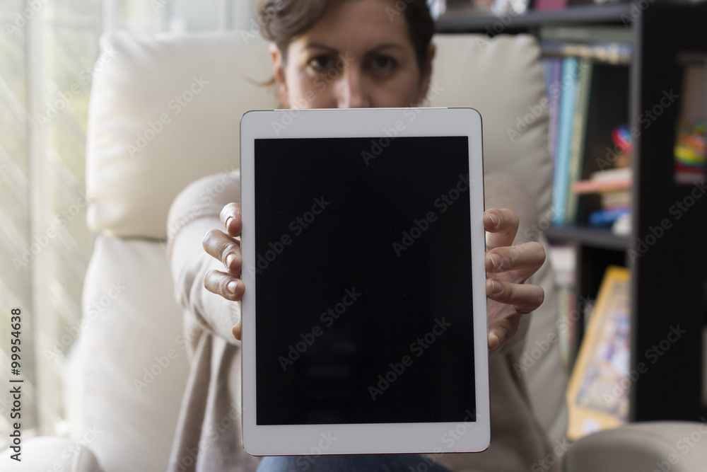 Woman holding tablet with blank screen Woman holding tablet with blank screen
