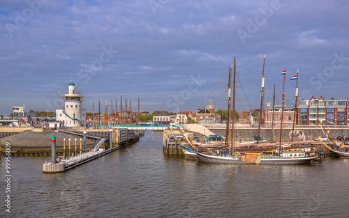 Entrance Harlingen harbor on the wadden sea photo