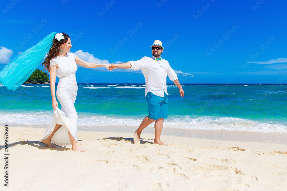 Beautiful brunette bride in white wedding dress with turquoise v Beautiful brunette bride in white wedding dress with turquoise v