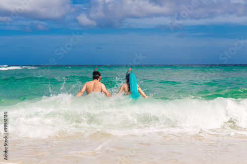 Happy couple having fun on the beach of a tropical island Summe © frolova_elena