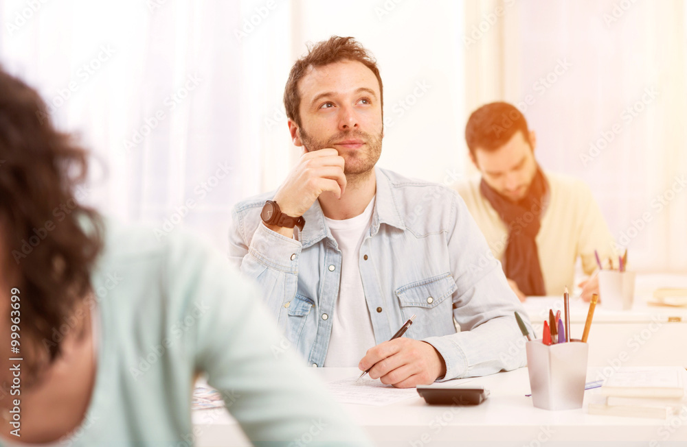 Fototapeta premium Young attractive student taking exams