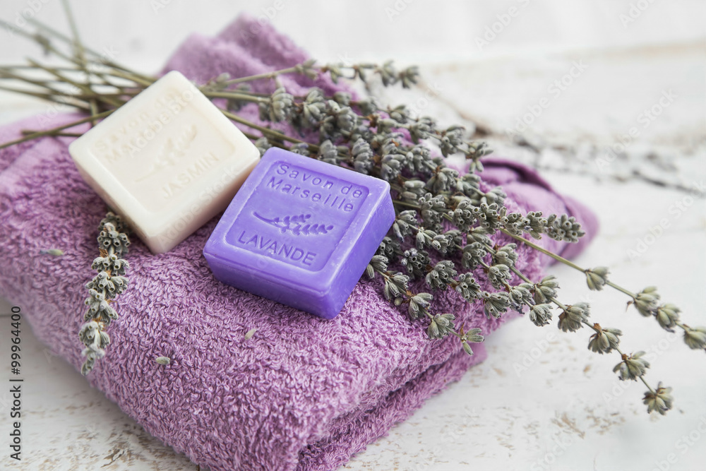 Spa products with lavender soap,flowers and towel Spa products with lavender soap,flowers and towel