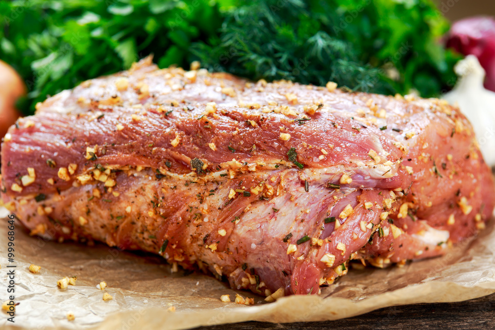 Fresh pork carbonade, meat marinated and prepared for roast with garlic, herbs Fresh pork carbonade, meat marinated and prepared for roast with garlic, herbs