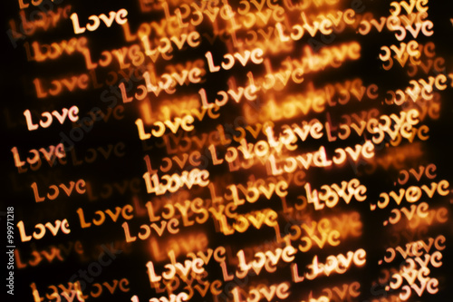 Blurring lights bokeh background of words LOVE