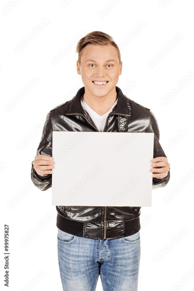 Fototapeta premium young man holding a blank panel against a white background