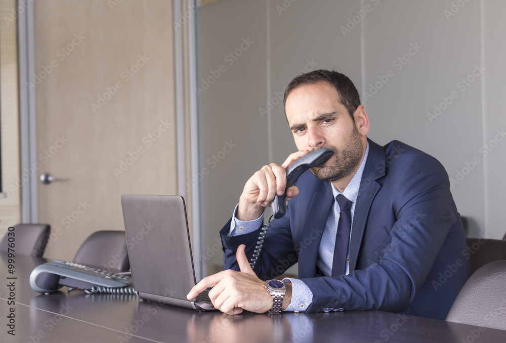 Thoughtful businessman working on laptop Thoughtful businessman working on laptop