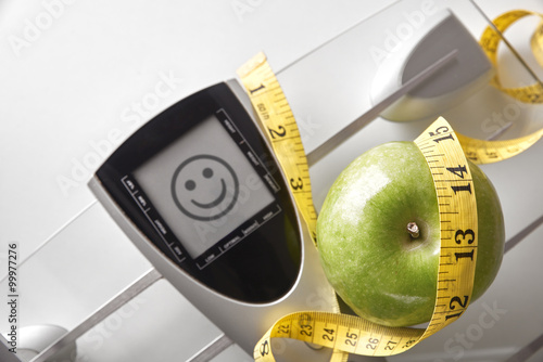 Φωτογραφία Nutrition and weight control concept top with happy face message