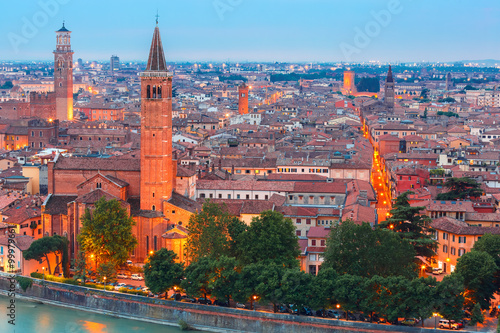 Verona skyline with river Adige, Santa Anastasia Church and Torre dei Lamberti or Lamberti Tower at evening, view from Piazzale Castel San Pietro, Italy