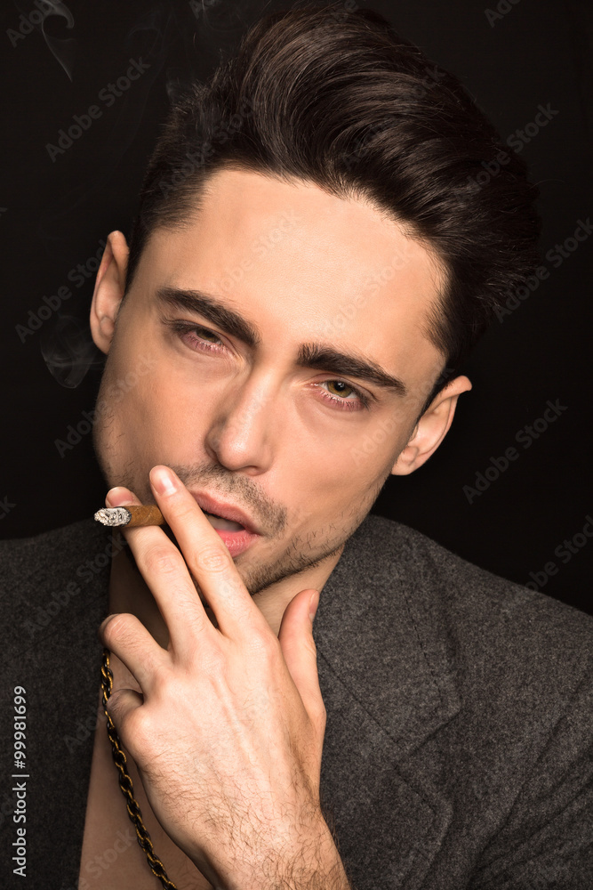 Model man smoking in studio Model man smoking in studio