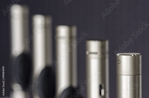 Condenser microphones placed in microphone stands in a lab of so