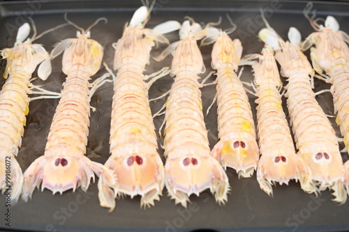 tray of seafood cooked on the grill 