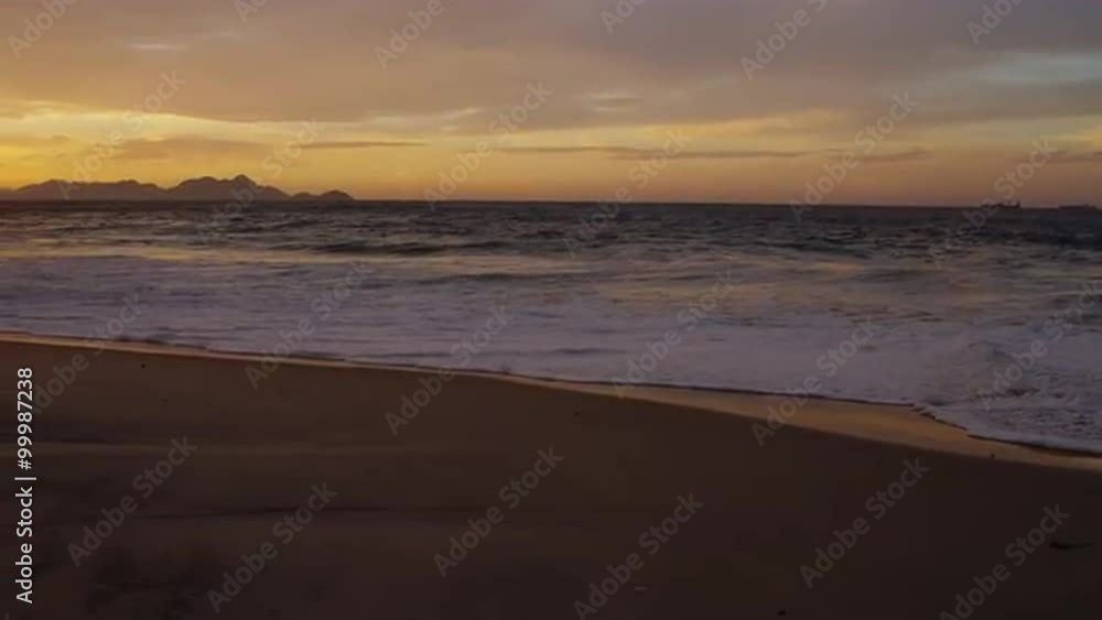 Slow motion, tracking shot across the sand as waves flow in on Praia do Diabo Slow motion, tracking shot across the sand as waves flow in on Praia do Diabo