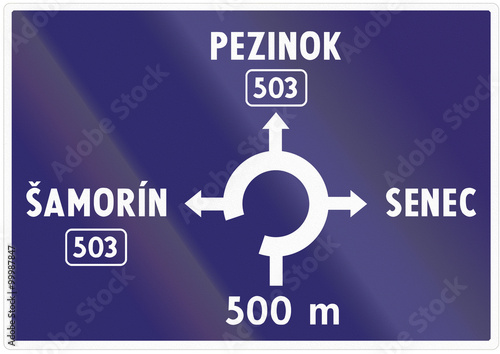 Road sign used in Slovakia - Advance information about intersection with roundabout photo