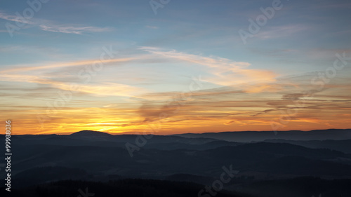 Fototapeta Naklejka Na Ścianę i Meble -  Sunset over the hills in the fog.