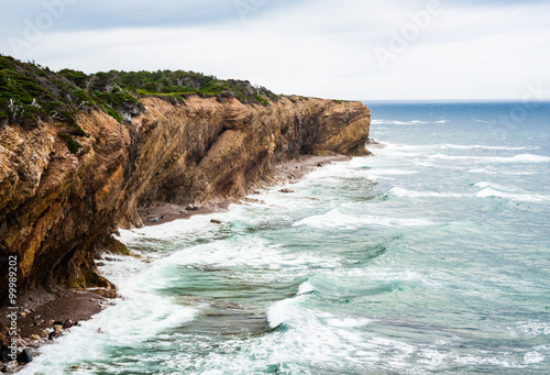 Wave splashing against eroding diagonal cliffs