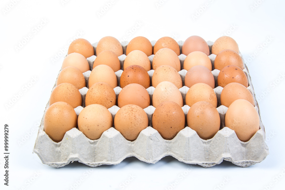 Egg in an egg crate on white background Egg in an egg crate on white background