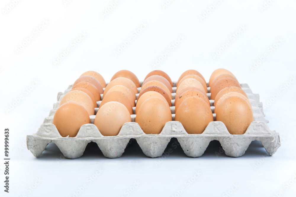 Egg in an egg crate on white background Egg in an egg crate on white background