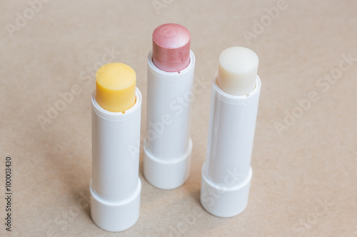 Moisturizer lipstick on brown natural background photo