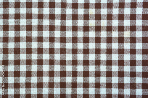Brown and white tablecloth background.