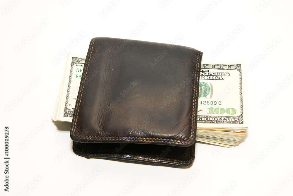 Old wallet with banknotes of US dollars inside Old wallet with banknotes of US dollars inside