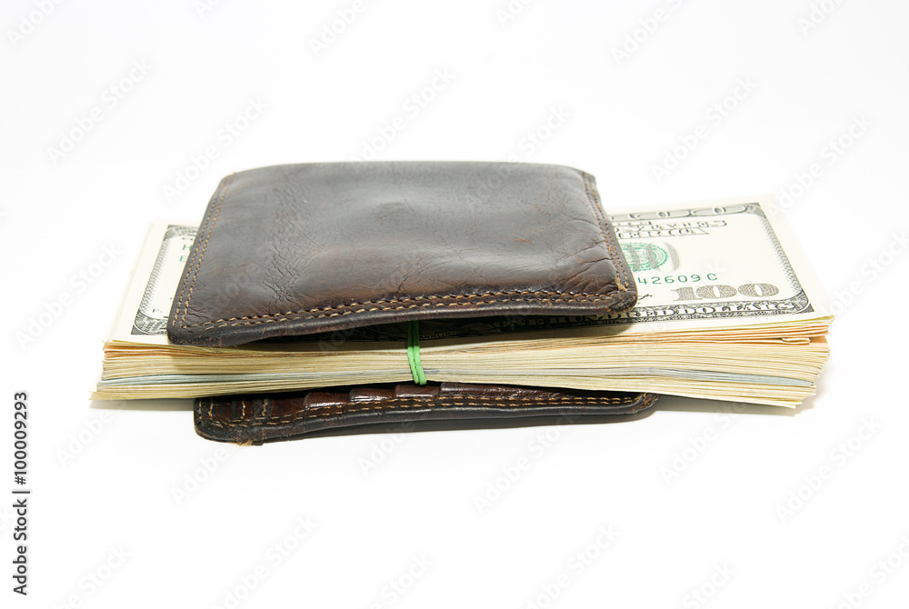Old wallet with banknotes of US dollars inside Old wallet with banknotes of US dollars inside